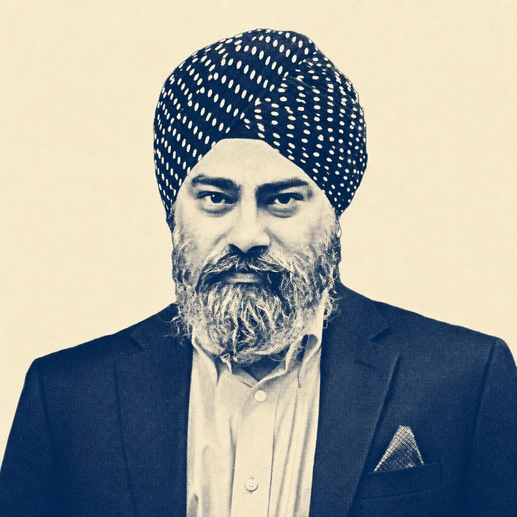 Harpreet Singh, in a polka-dot dastar, navy blazer and blue shirt.