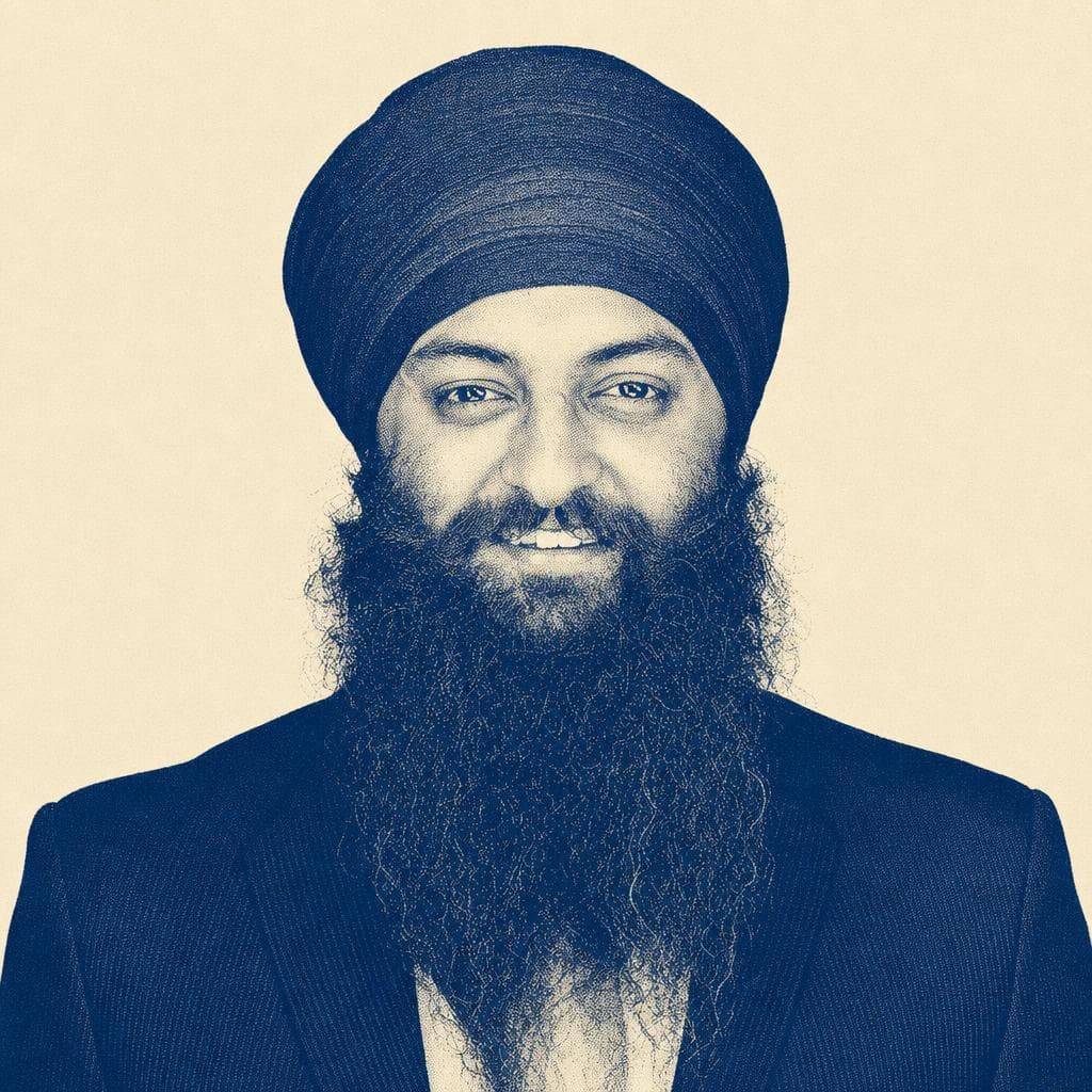 Harsimranjit Singh, in a bright blue dastar, in a studio headshot.